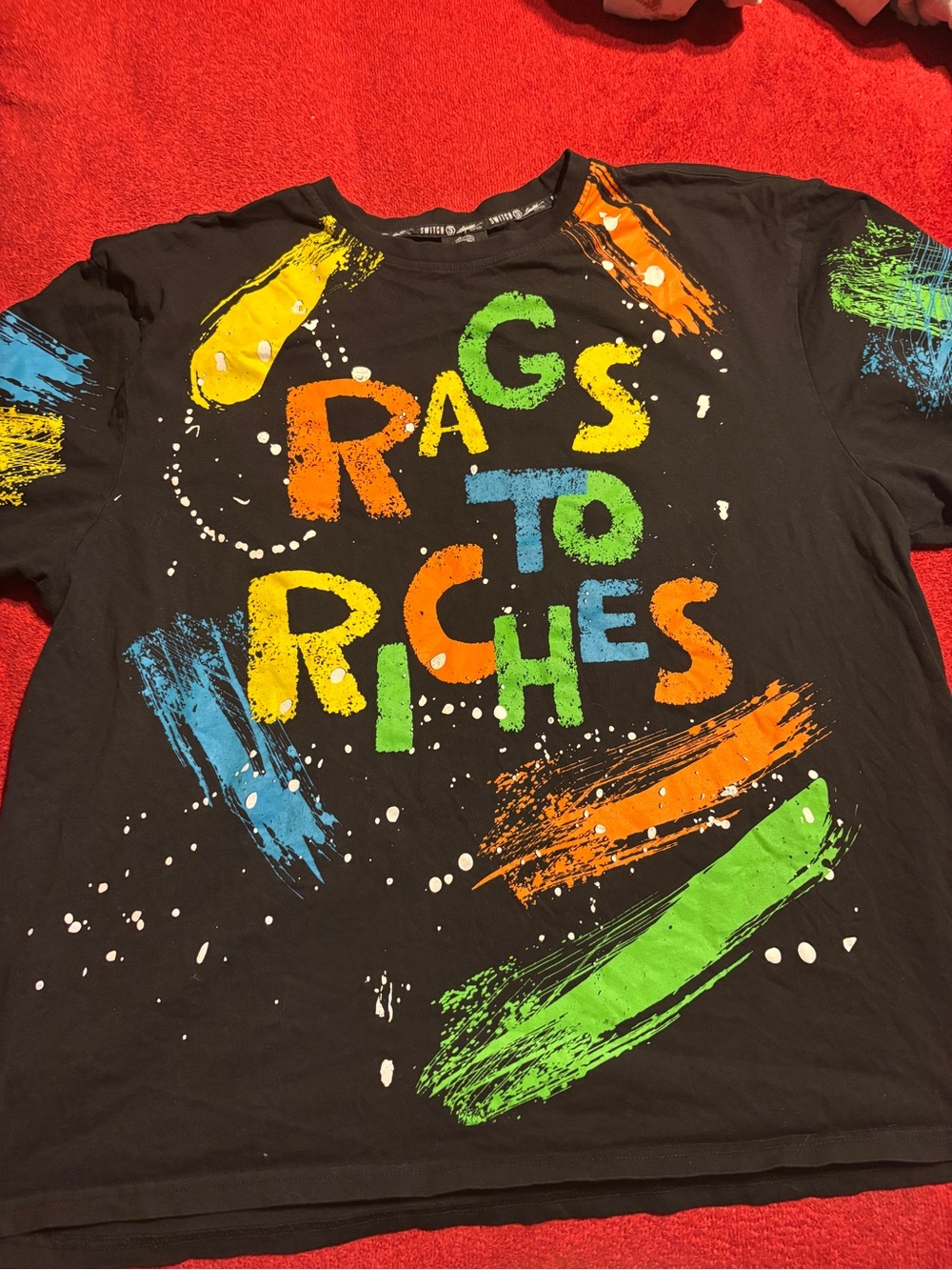 Switch Men’s Black Graphic Tee with Colorful 'Rags to Riches' Print. Size 4X